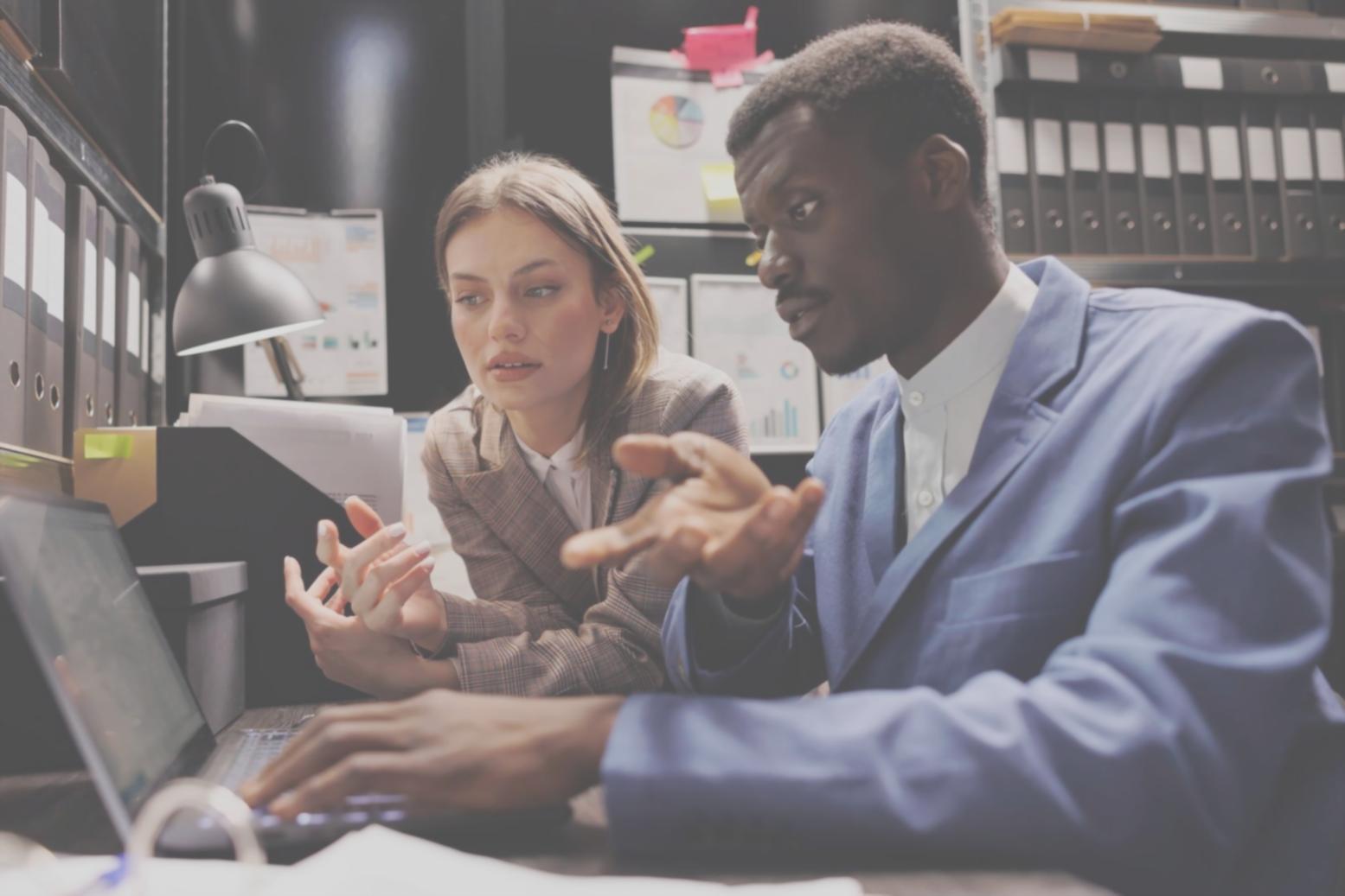 Financial analyst reviewing comprehensive market data and business reports